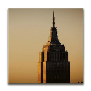 Vertical View Of The Top Of The Empire State Building At Sunrise